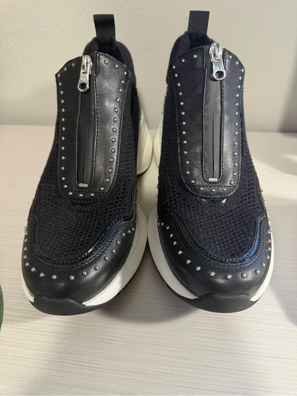 Michael Kors Zuma Black and White Zip-Front Platform Sneakers with Stud Detail